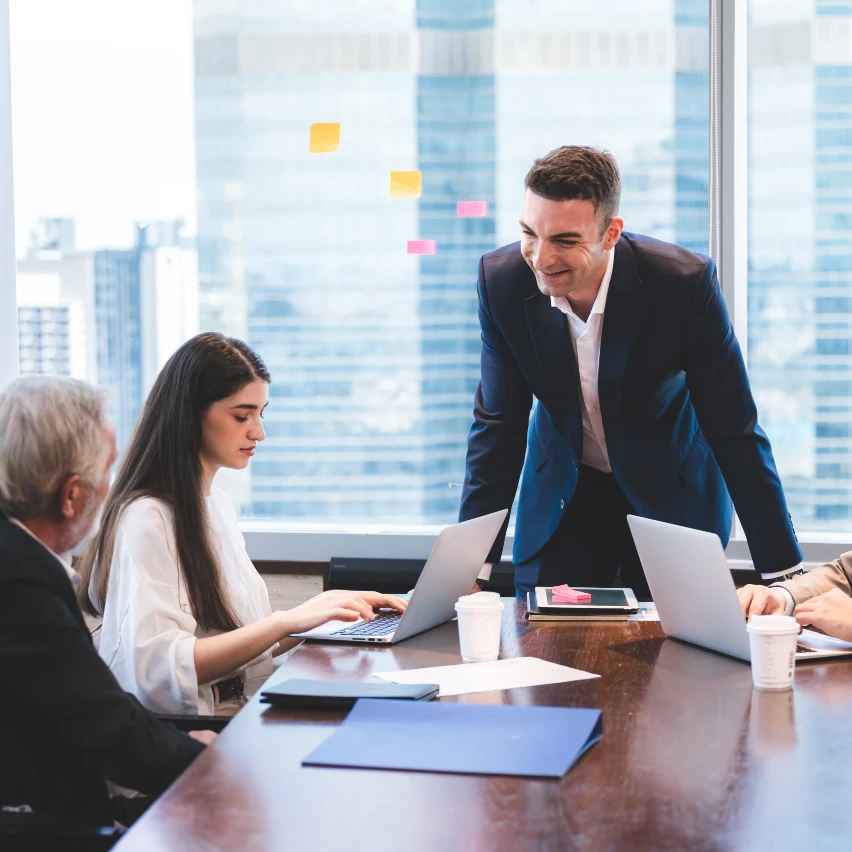 Business team meeting in a modern office with city skyline view