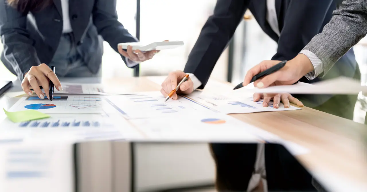 Business professionals analyzing financial reports and charts